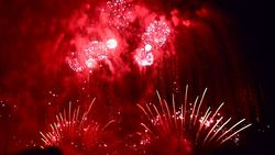 ミナハサ高原トモホン市の大晦日と日本の花火/合成画像2015年12月31日